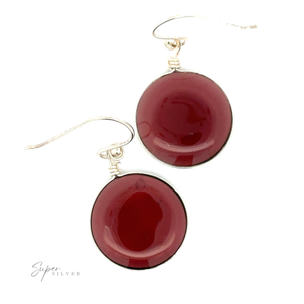 
                  
                    Pair of Round Glass Earrings featuring large, round, glossy, dark red stones and crafted from .925 Sterling Silver.
                  
                