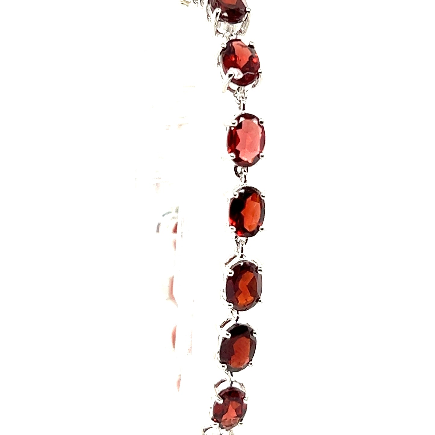 
                  
                    This Super Silver Pronged Garnet Bracelet features crimson garnet stones and a rhodium finish.
                  
                