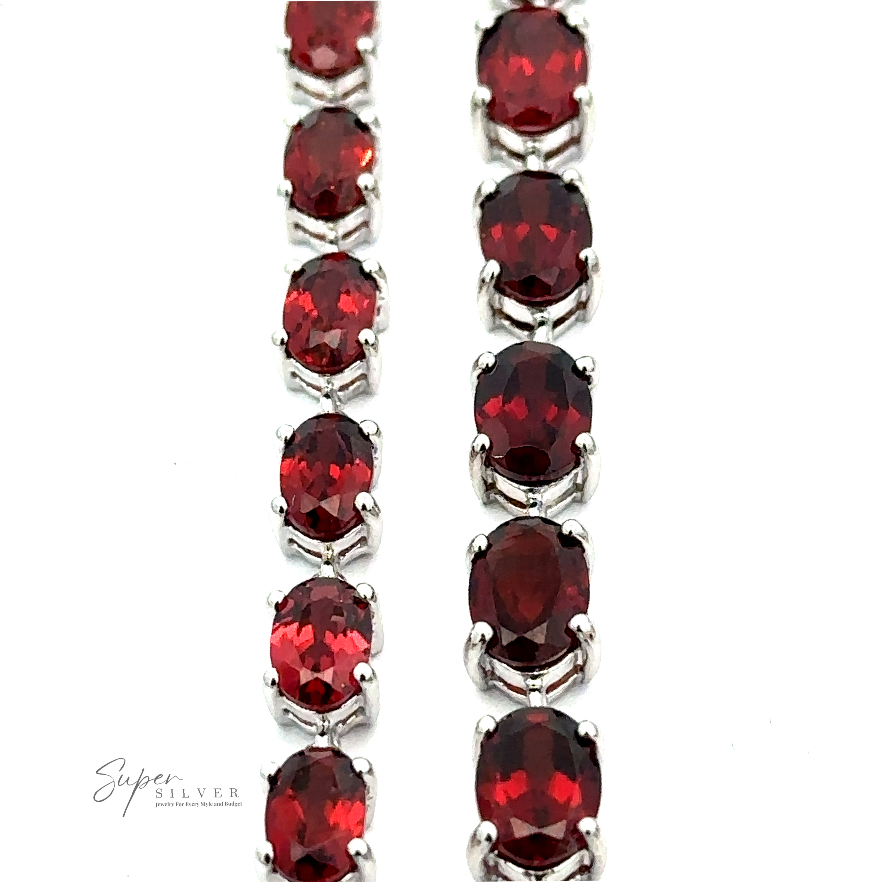 Rows of oval-cut red gemstones set in a Pronged Garnet Bracelet With Rhodium Finish.
