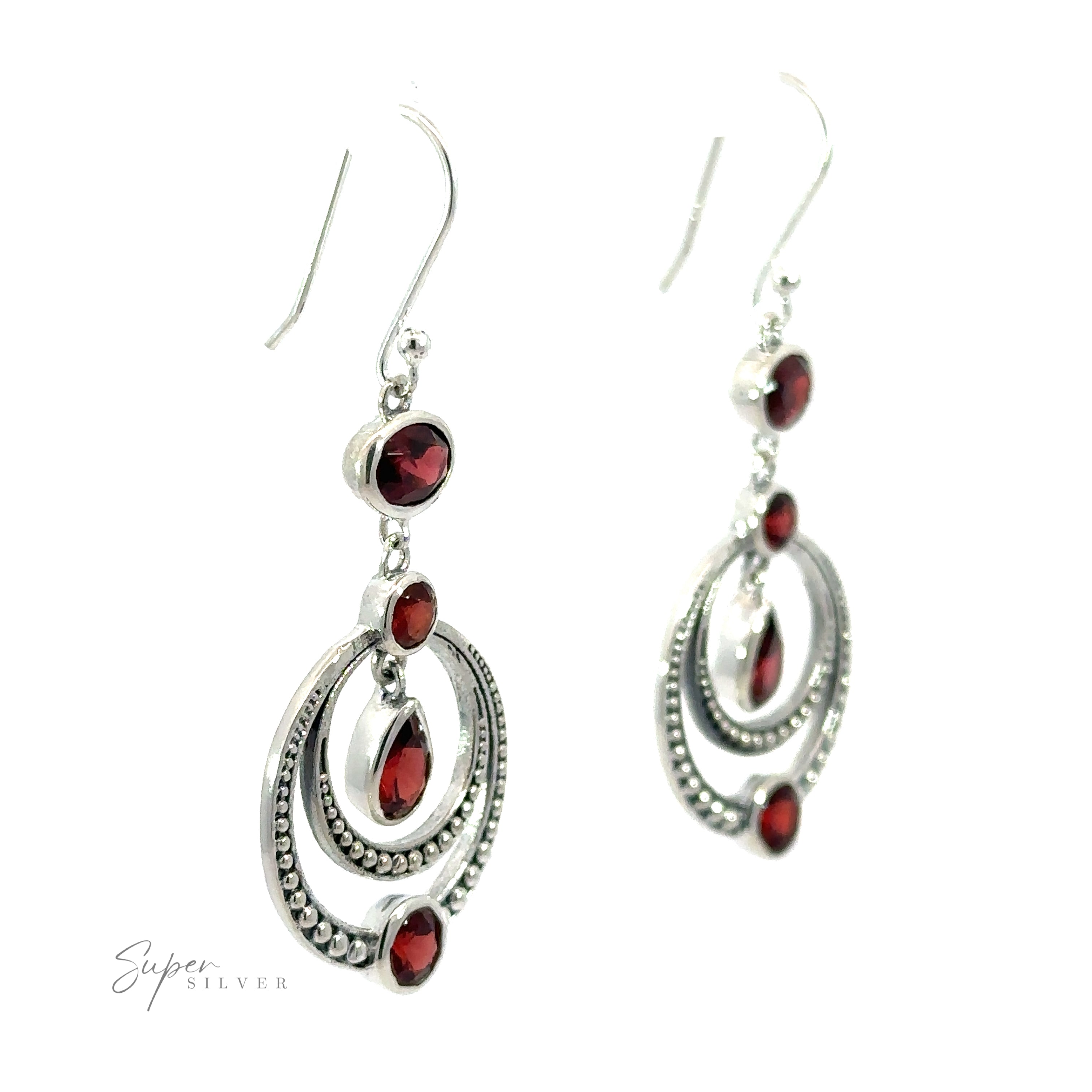 A pair of dazzling Overlapping Circle Earrings with Vibrant Gemstones, featuring multiple oval and round shapes, is displayed against a white background. These Bali-style earrings add a touch of exotic elegance to any ensemble.