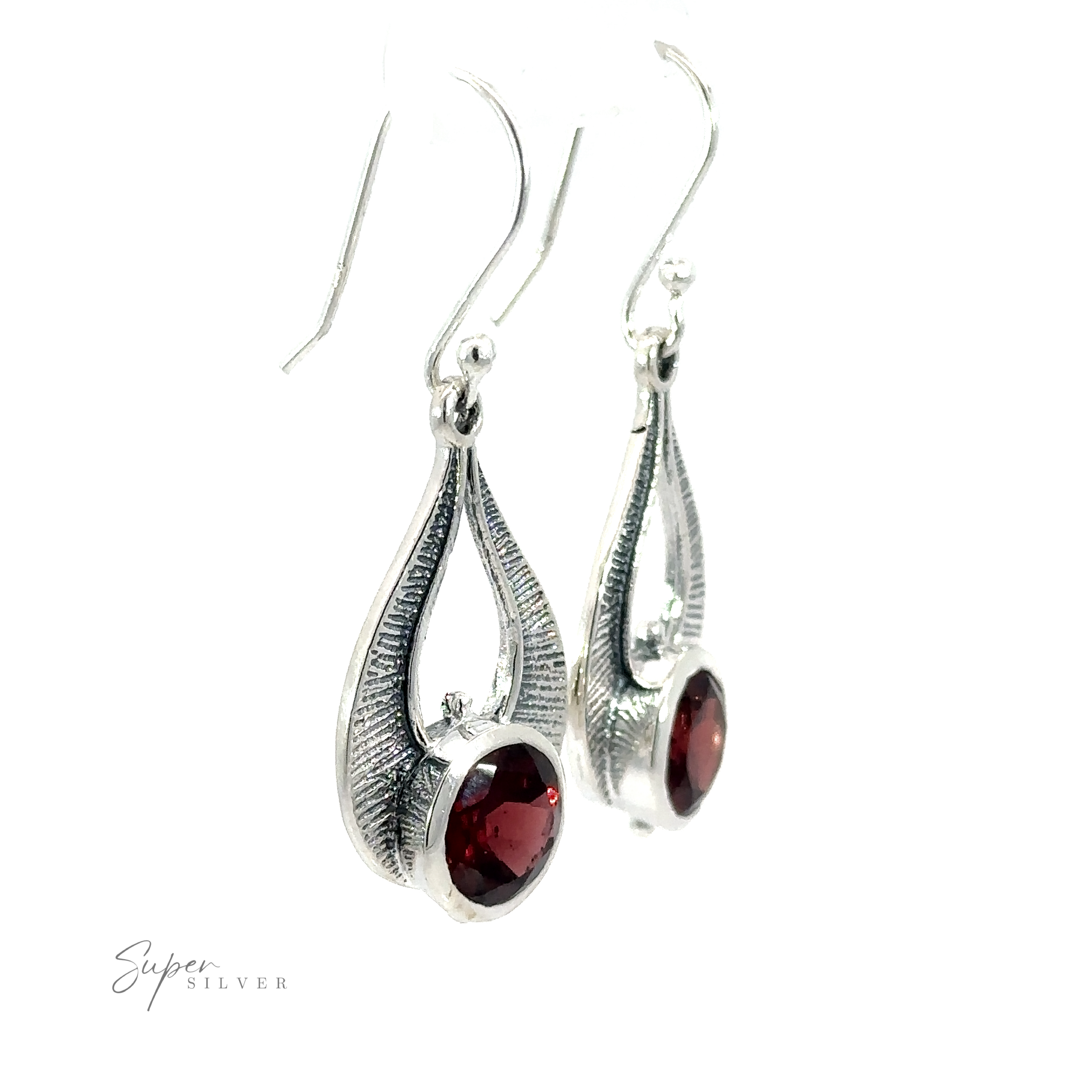 Winged Gemstone Earrings featuring elongated, teardrop-shaped settings with dark red garnet gemstones at the center. The brand name "Super Silver" is visible in the bottom left corner.