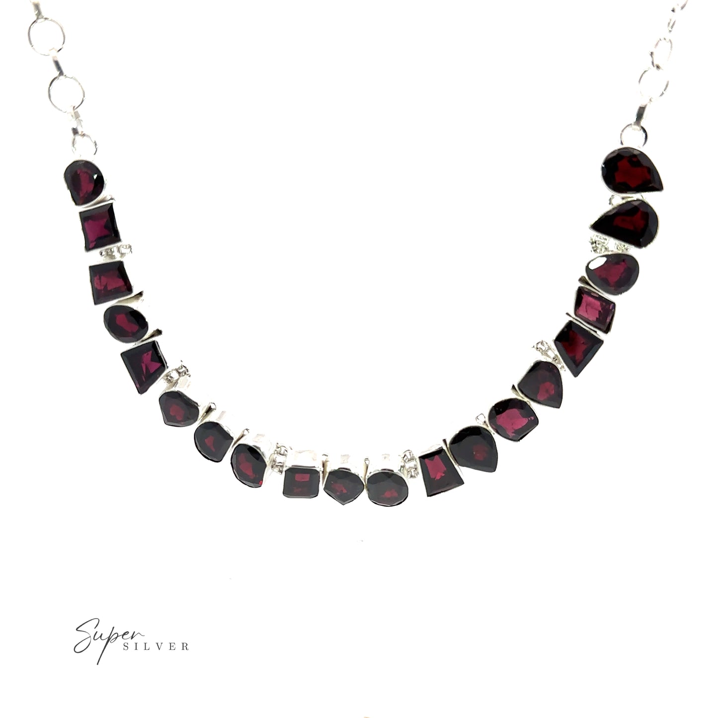 
                  
                    A Statement Gemstone Necklace with variously shaped red stones, including garnet, arranged in a semi-circle, is displayed against a white background. The text "Super Silver" is visible in the bottom left corner.
                  
                