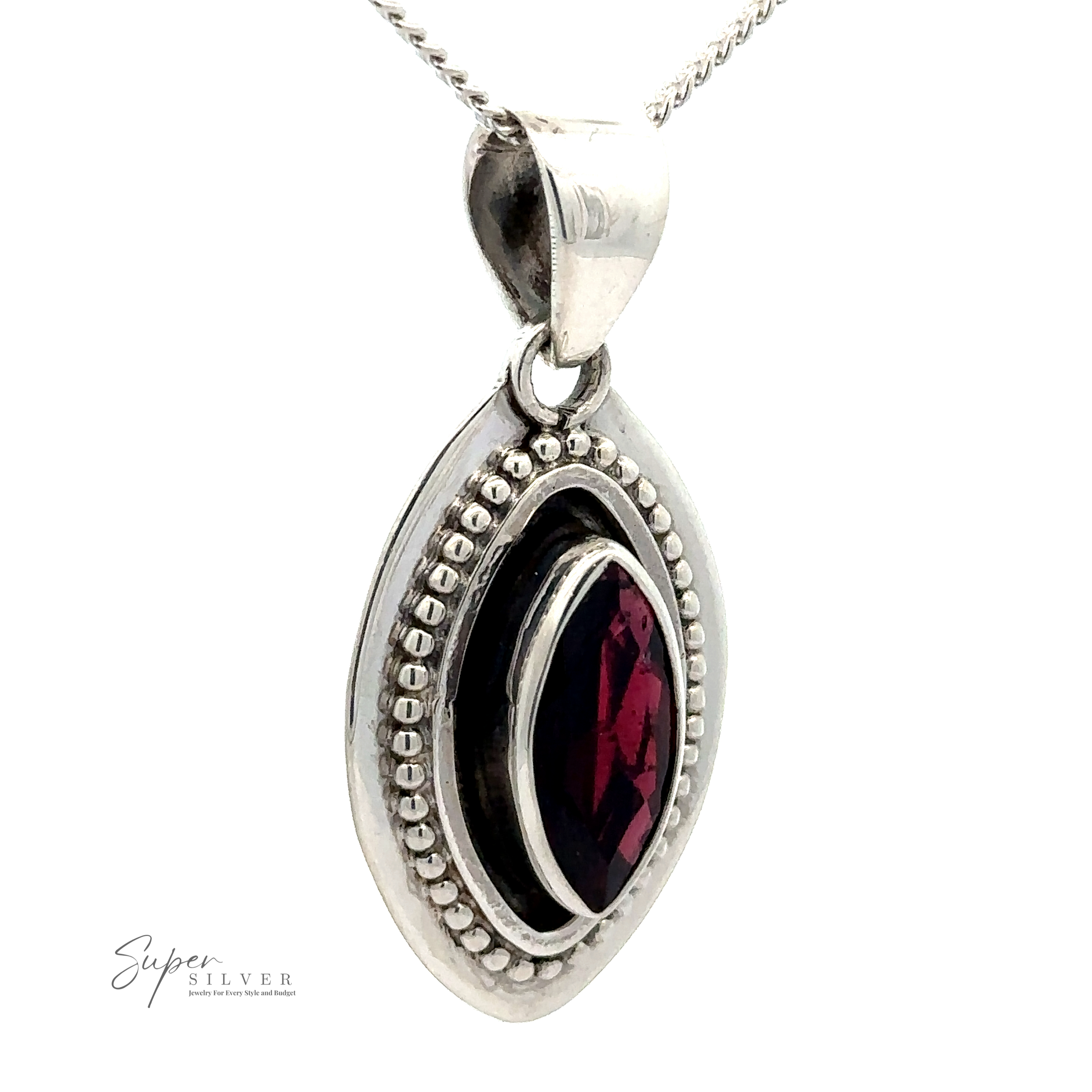 A Beautiful Marquise Pendant With Beaded Design with a marquise-shaped, deep red stone set in the center, surrounded by a beaded sterling silver frame. The necklace chain is partially visible. The word "Super Silver" is printed on the bottom left.