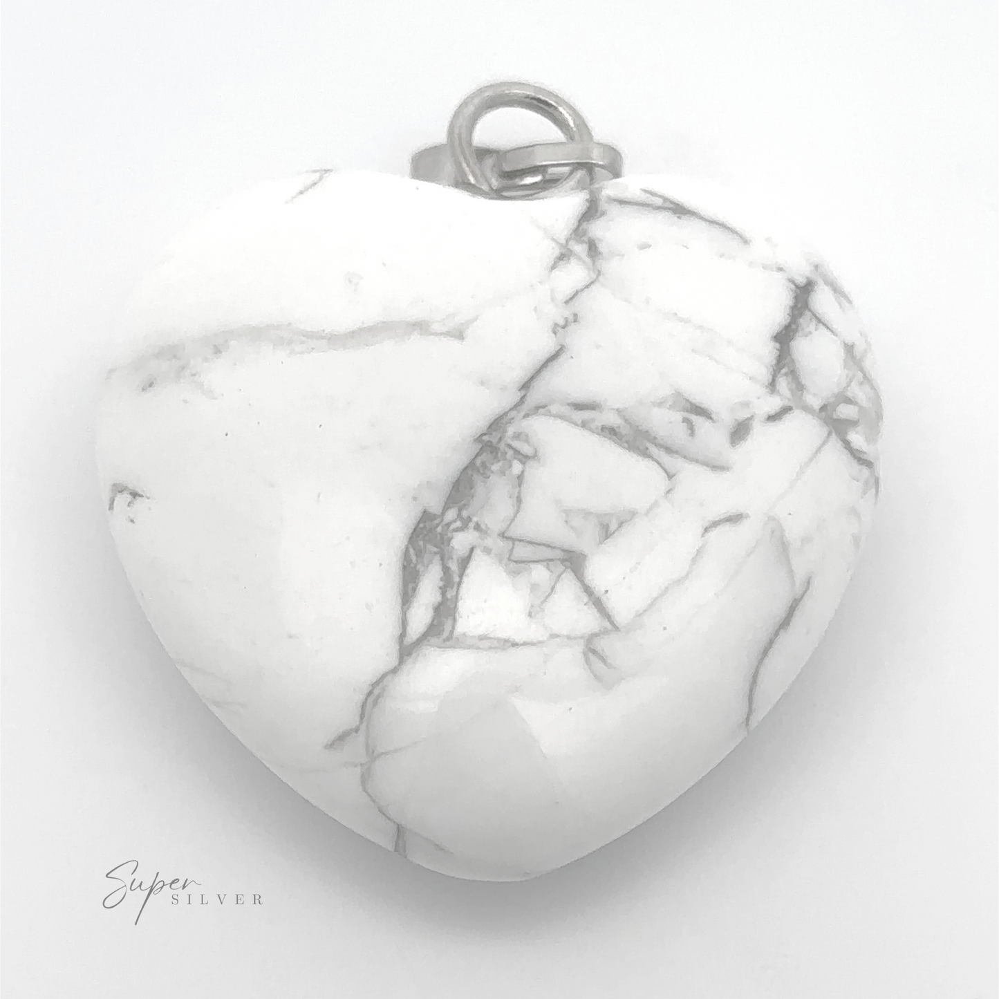 
                  
                    A Heart Stone Pendant made of white marble with gray veins, featuring a small metal loop at the top for everyday wear. Letters "Super Silver" are visible in the bottom left corner.
                  
                