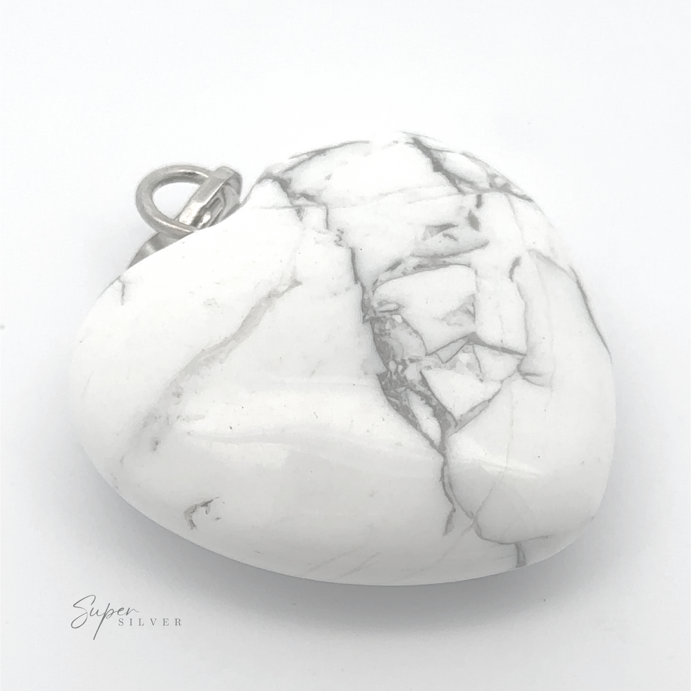 
                  
                    A heart-shaped white marble pendant with grey veins and a metal loop at the top, perfect for everyday wear, placed against a white background. The word "Heart Stone Pendant" is visible in the bottom left corner.
                  
                