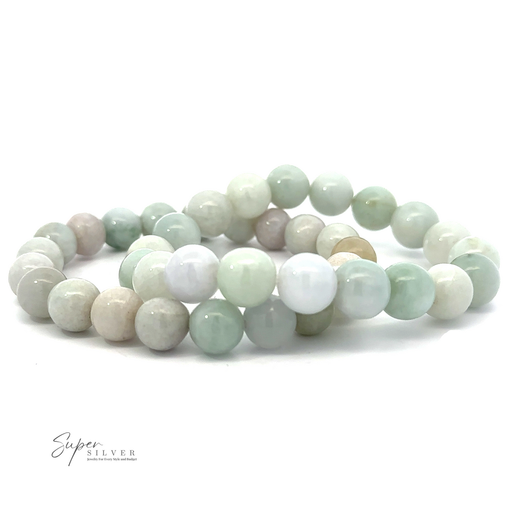 Two intertwined Elegant Jade Beaded Bracelets made of 9-10mm round, smooth beads in soft pastel colors, predominantly white and light green, strung on a high-quality stretchable nylon string, with a "Super Silver" logo in the bottom left corner.