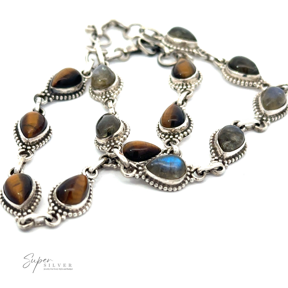 
                  
                    A Teardrop Shape Stone Bracelet With Ball Border is elegantly displayed against a white background.
                  
                