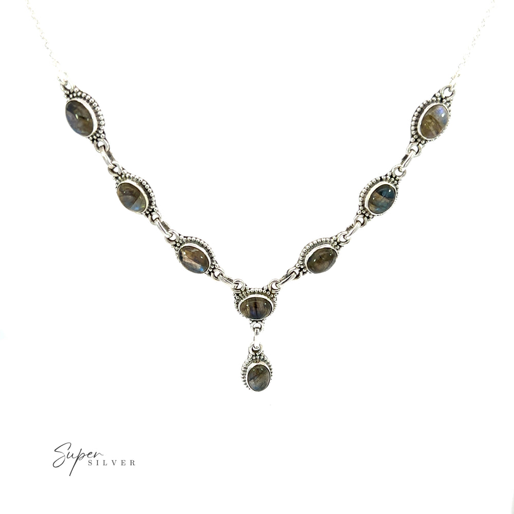 
                  
                    Gemstone Y-Necklaces with Beaded Border featuring a Labradorite and sterling silver pendant.
                  
                