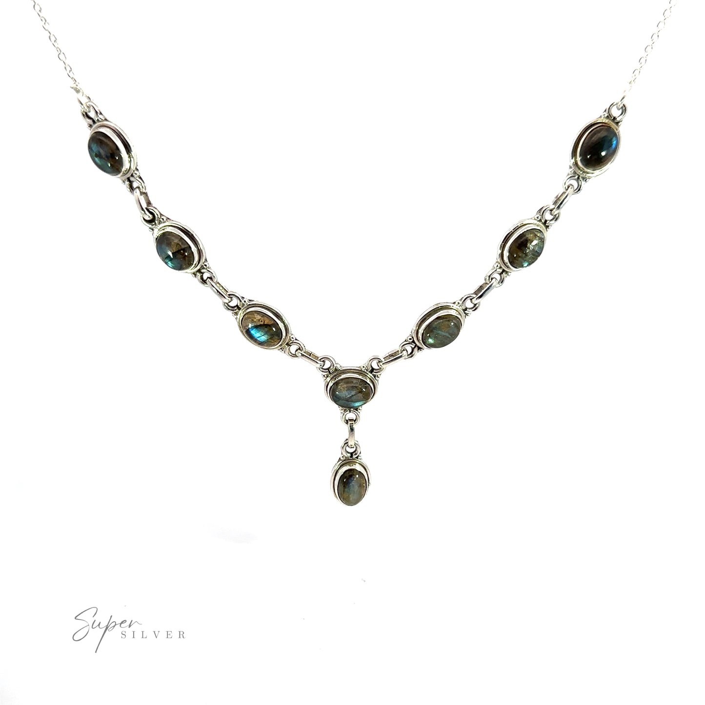 
                  
                    A Simple Oval Y Necklace with Gemstones featuring nine oval gemstones linked together with silver chains forming a symmetrical pattern, displayed against a white background, exuding a touch of bohemian charm.
                  
                