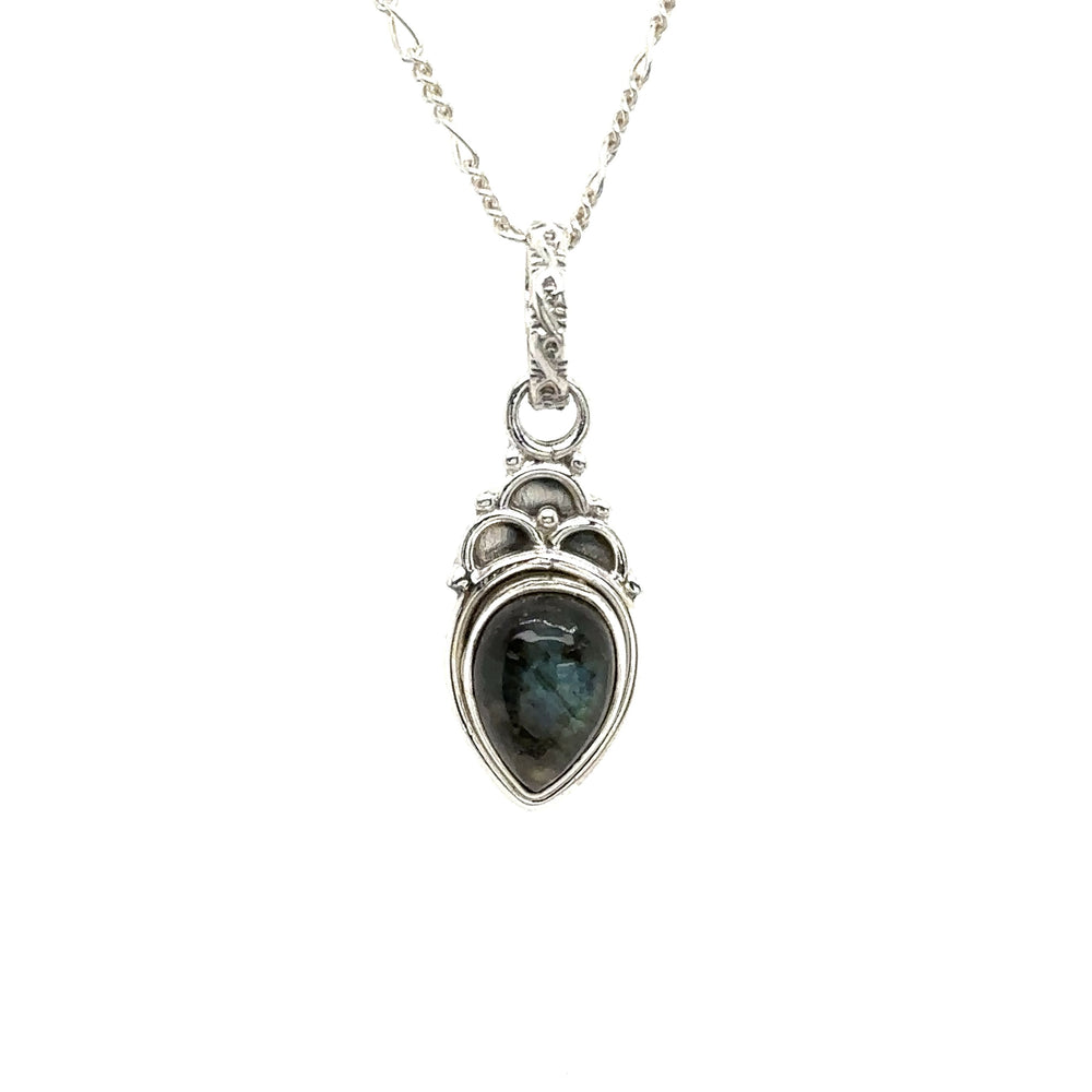 
                  
                    A boho-inspired Dainty Gemstone Teardrop Pendant with a labradorite stone, showcasing free-spirited elegance.
                  
                