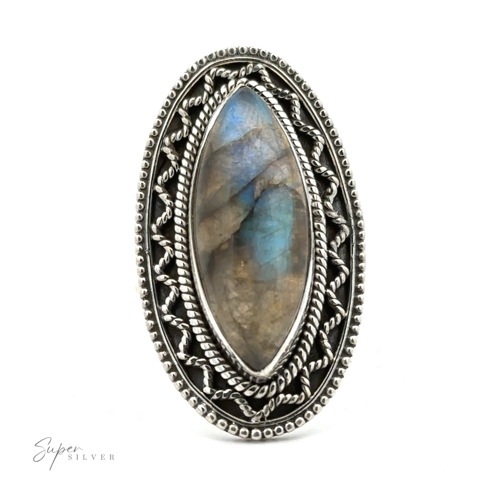 
                  
                    A marquise-shaped gemstone ring with vintage shield border. The gemstone displays subtle blue and brown hues, offering a bohemian twist to any outfit.
                  
                