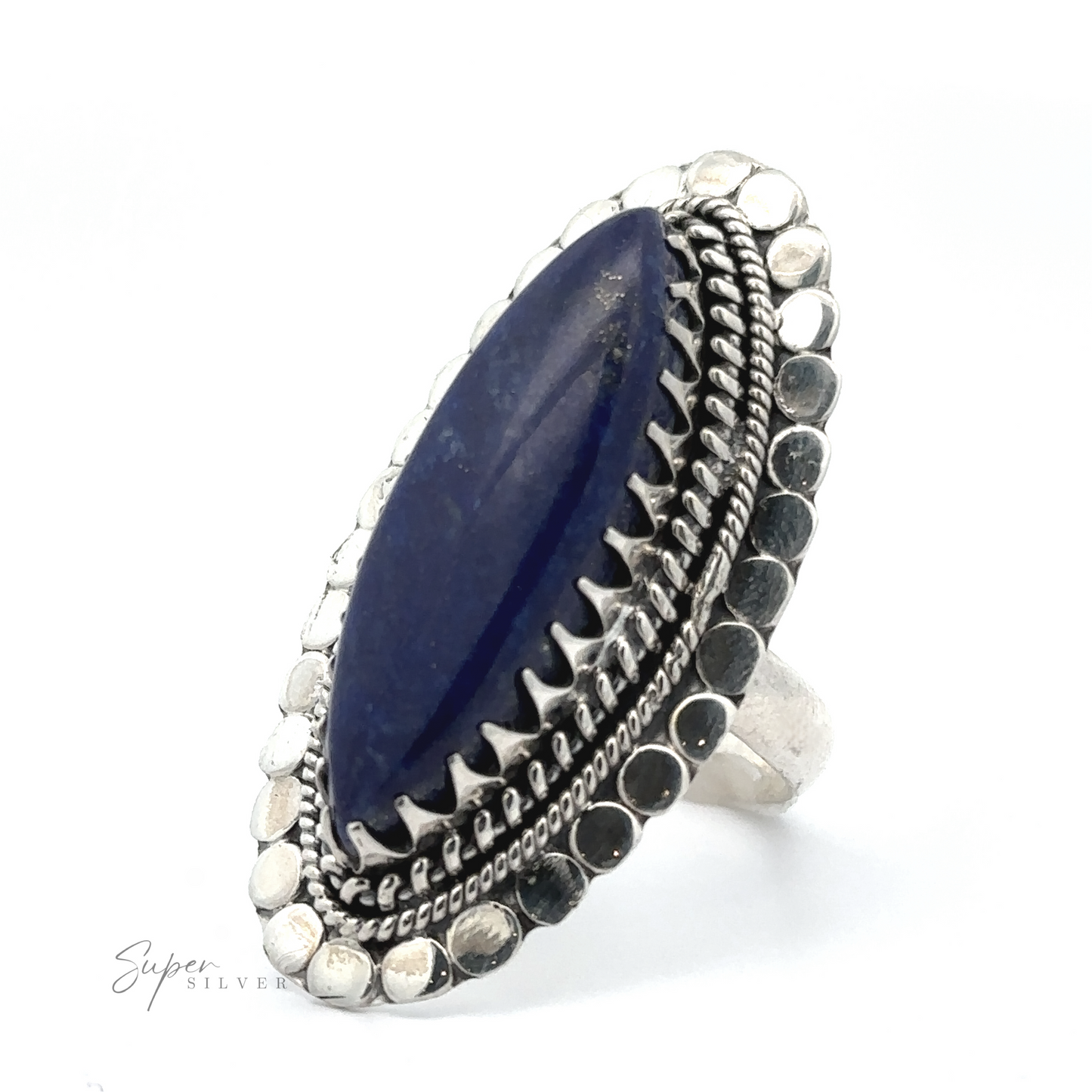 
                  
                    A silver ring with a marquise-shaped blue gemstone is displayed against a white background. The band features intricate detailing and a beaded border, embodying the essence of bohemian jewelry. The product name for this beautiful piece is Statement Marquise Shaped Gemstone Ring.
                  
                