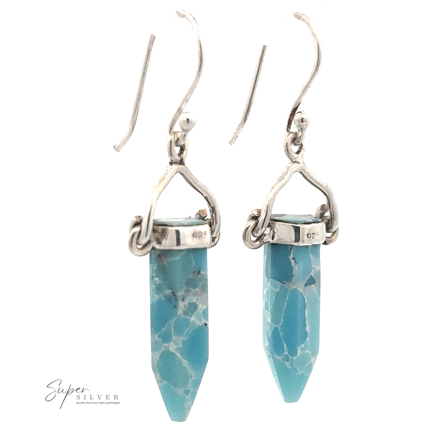 
                  
                    A pair of Obelisk Shape Raw Larimar Earrings with sterling silver French hooks and mountings. The gemstones are shaped into elongated hexagonal prisms.
                  
                