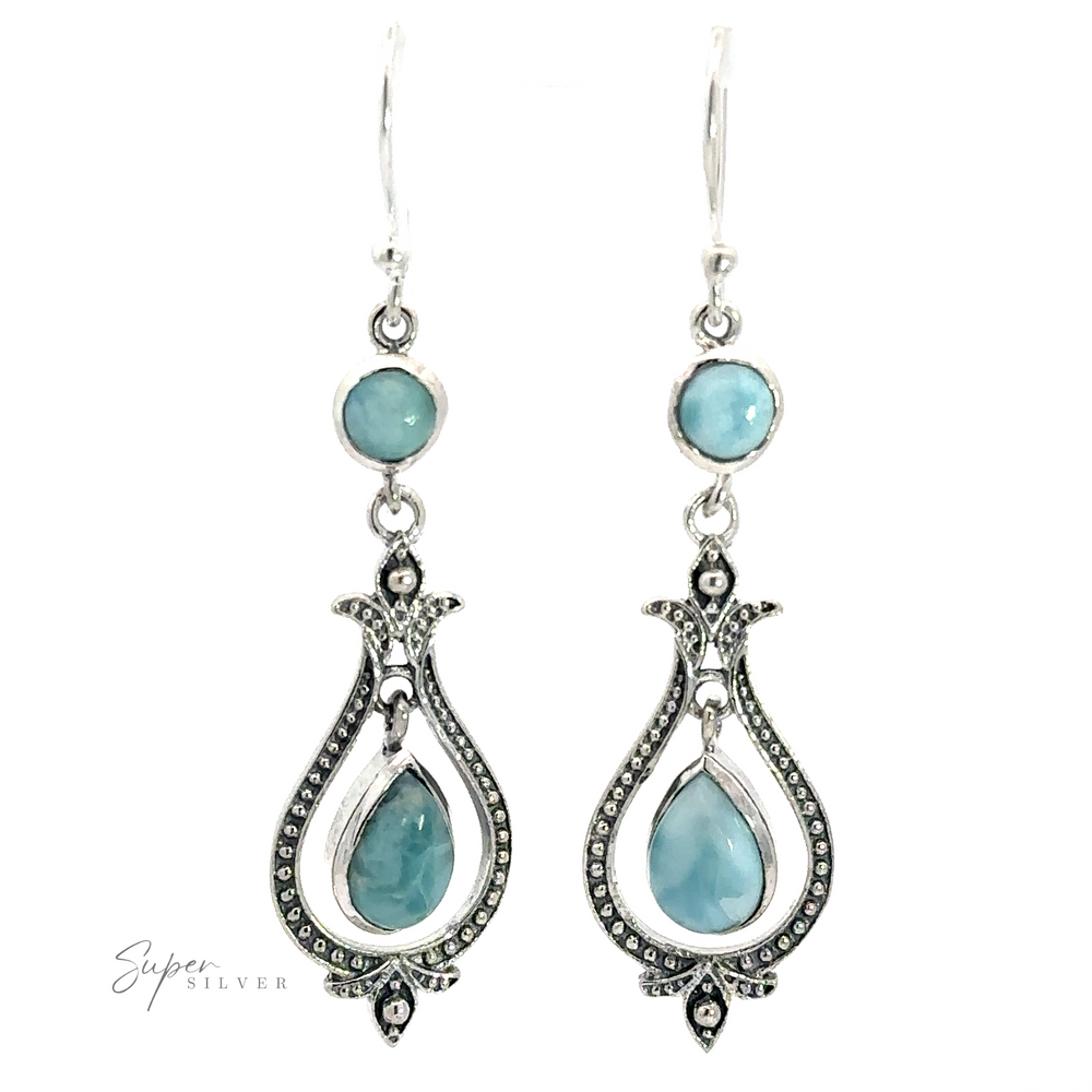 
                  
                    Vintage-Styled Teardrop Earrings with Gemstones featuring blue gemstones. The vintage-style teardrop earrings design includes a teardrop-shaped lower gemstone and a small round gemstone above, evoking the allure of Bali style.
                  
                