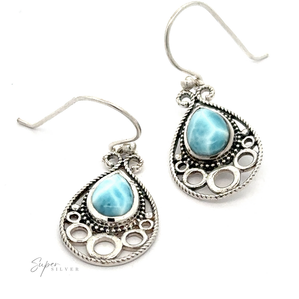 Teardrop Larimar Earrings with Larimar stone accents and an intricate cut-out design.