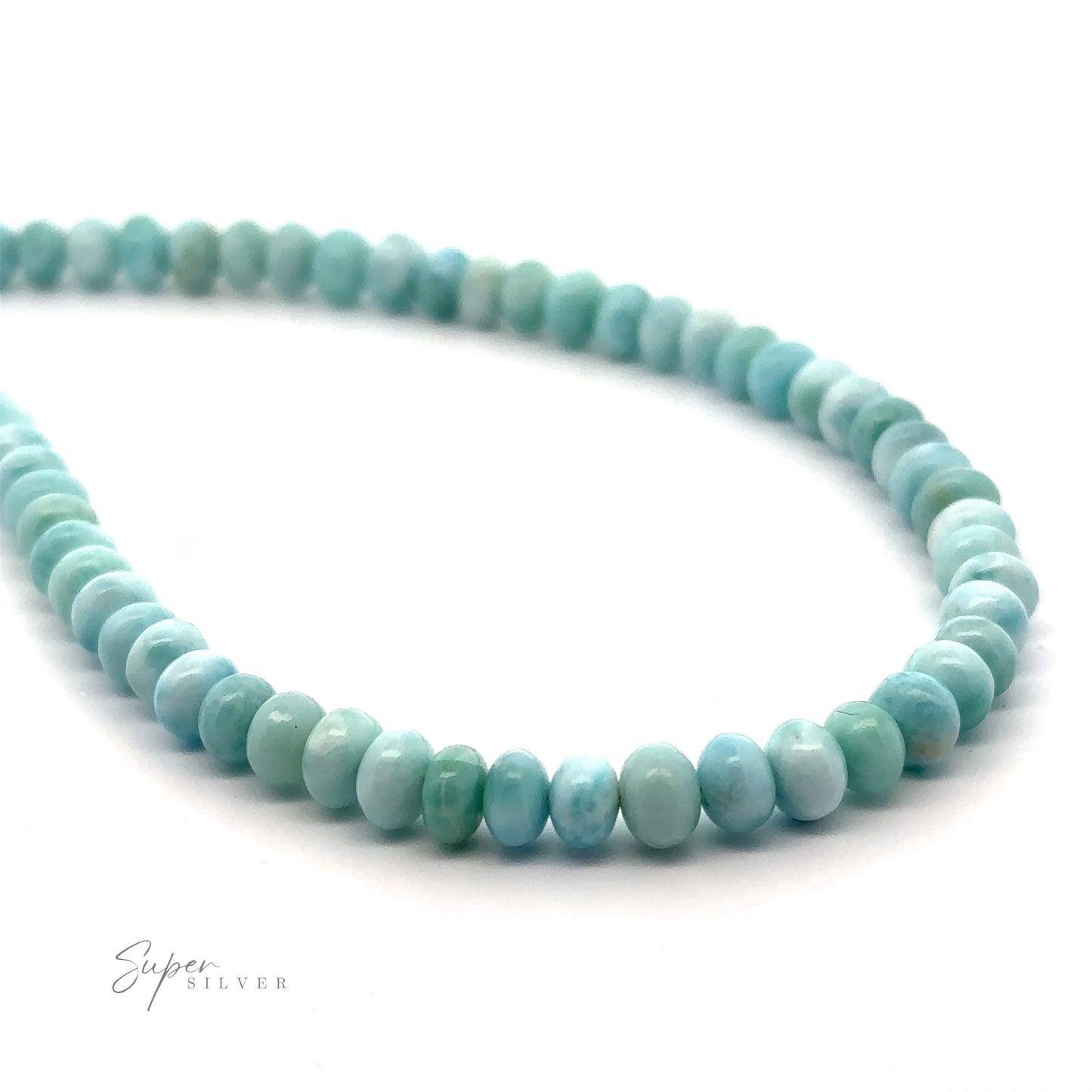 
                  
                    A Larimar Beaded Necklace with light blue-green round beads arranged in a continuous loop on a white background. The text "Super Silver" is visible in the bottom left corner.
                  
                
