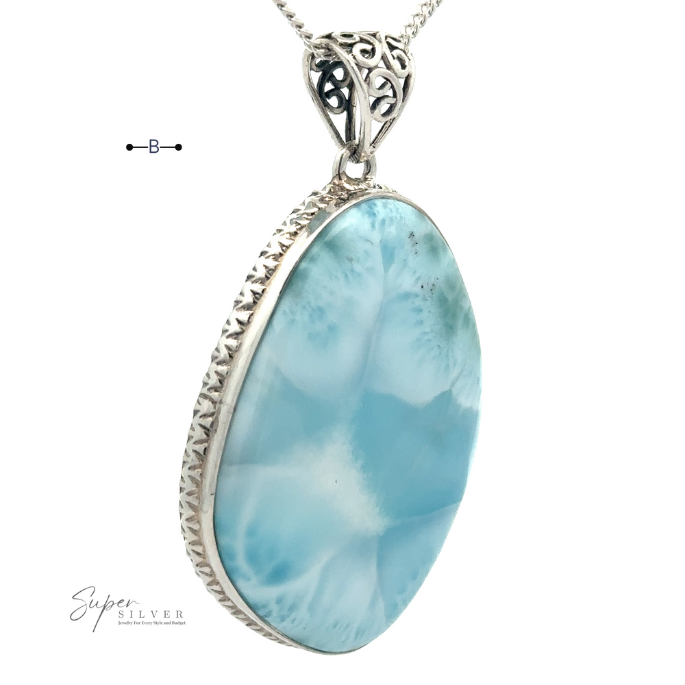 
                  
                    Freeform Large Larimar Pendant with a detailed sterling silver frame, suspended on a silver chain.
                  
                