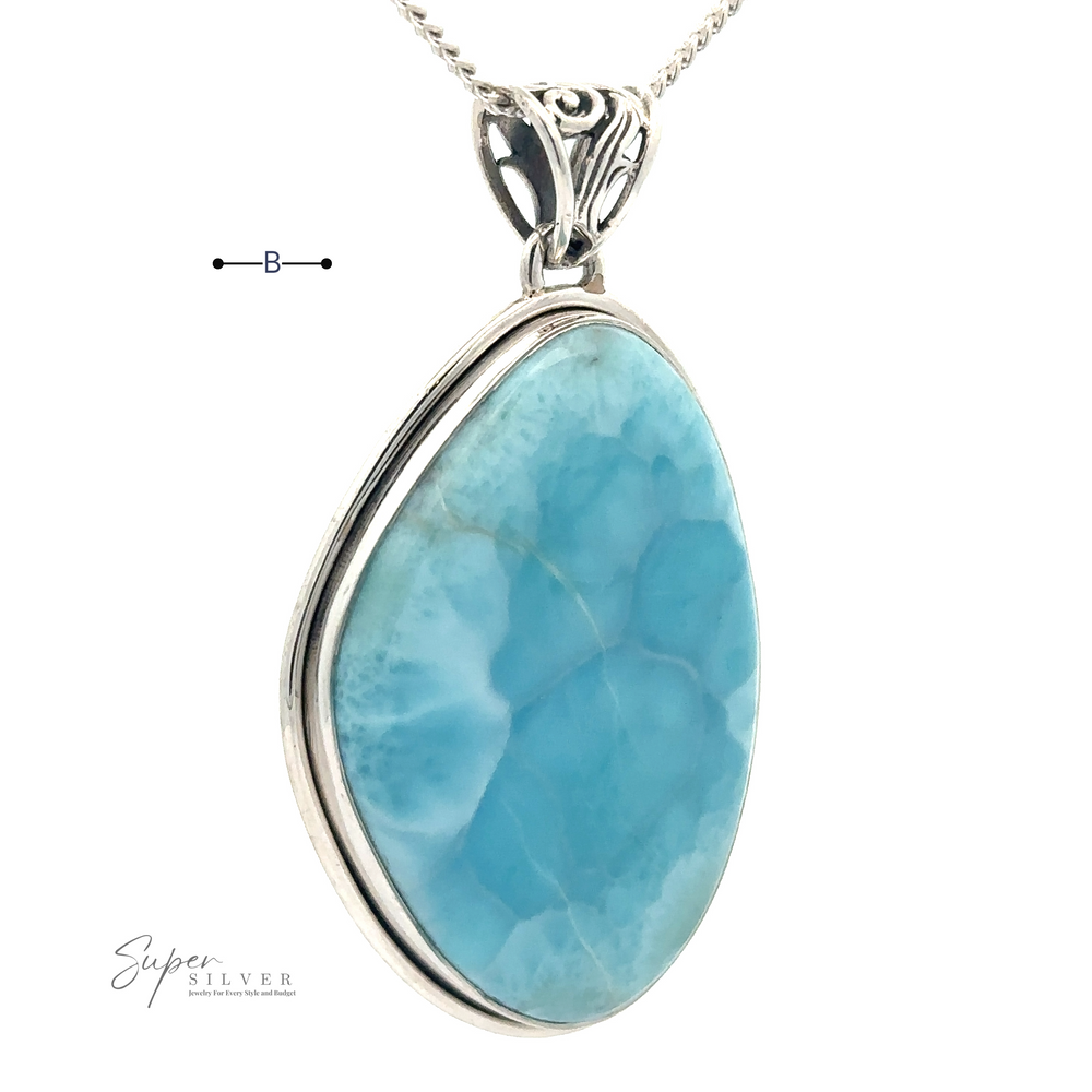 
                  
                    A teardrop-shaped Larimar Pendant with Simple Border in a sterling silver setting is suspended from a delicate silver chain. The elegant pendant features a pattern of lighter blue and white hues. The brand name "Super Silver" is visible.
                  
                