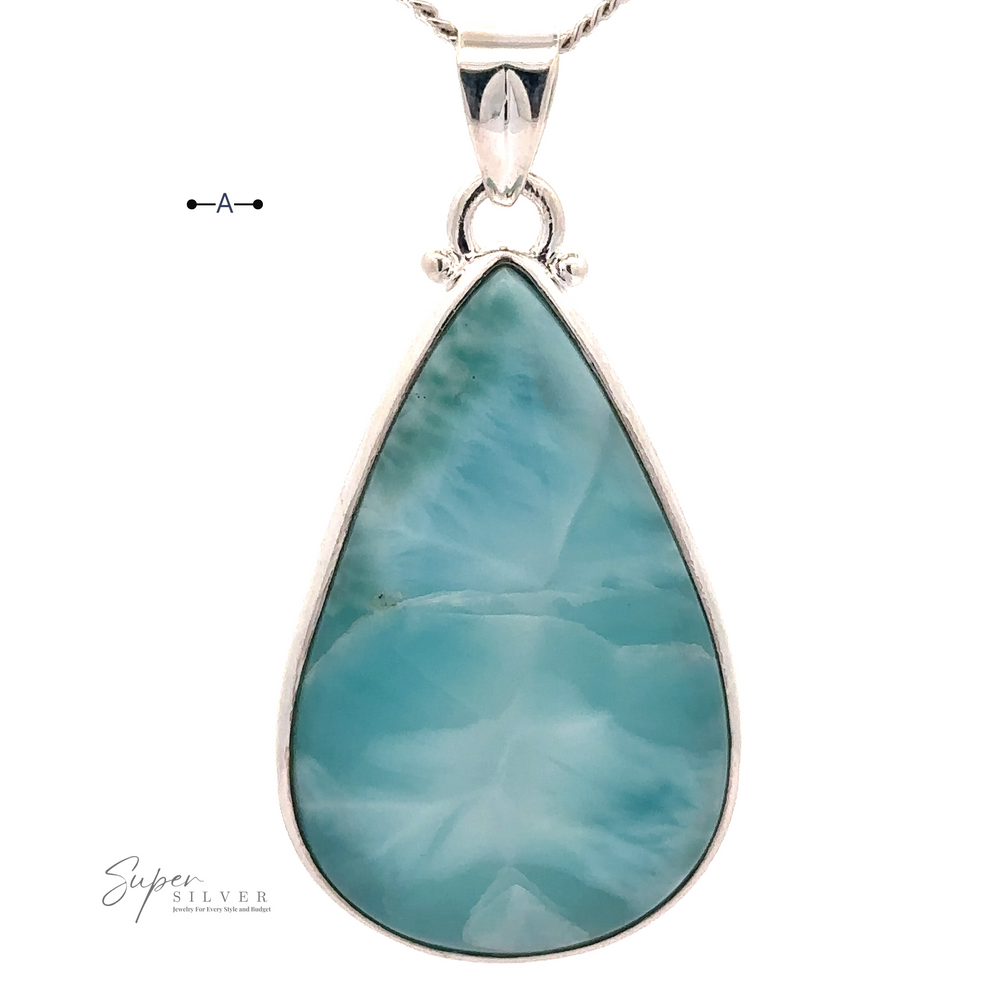 
                  
                    Close-up of a Larger Teardrop Larimar Pendant set in sterling silver with a thin chain. The text "Super Silver" is visible in the bottom left corner.
                  
                