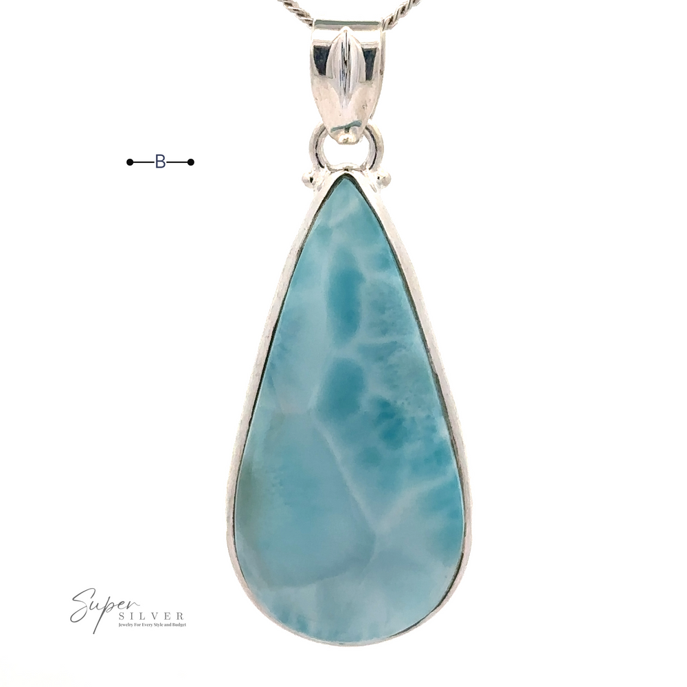 
                  
                    A Larger Teardrop Larimar Pendant set in sterling silver on a chain, labeled "Super Silver.
                  
                
