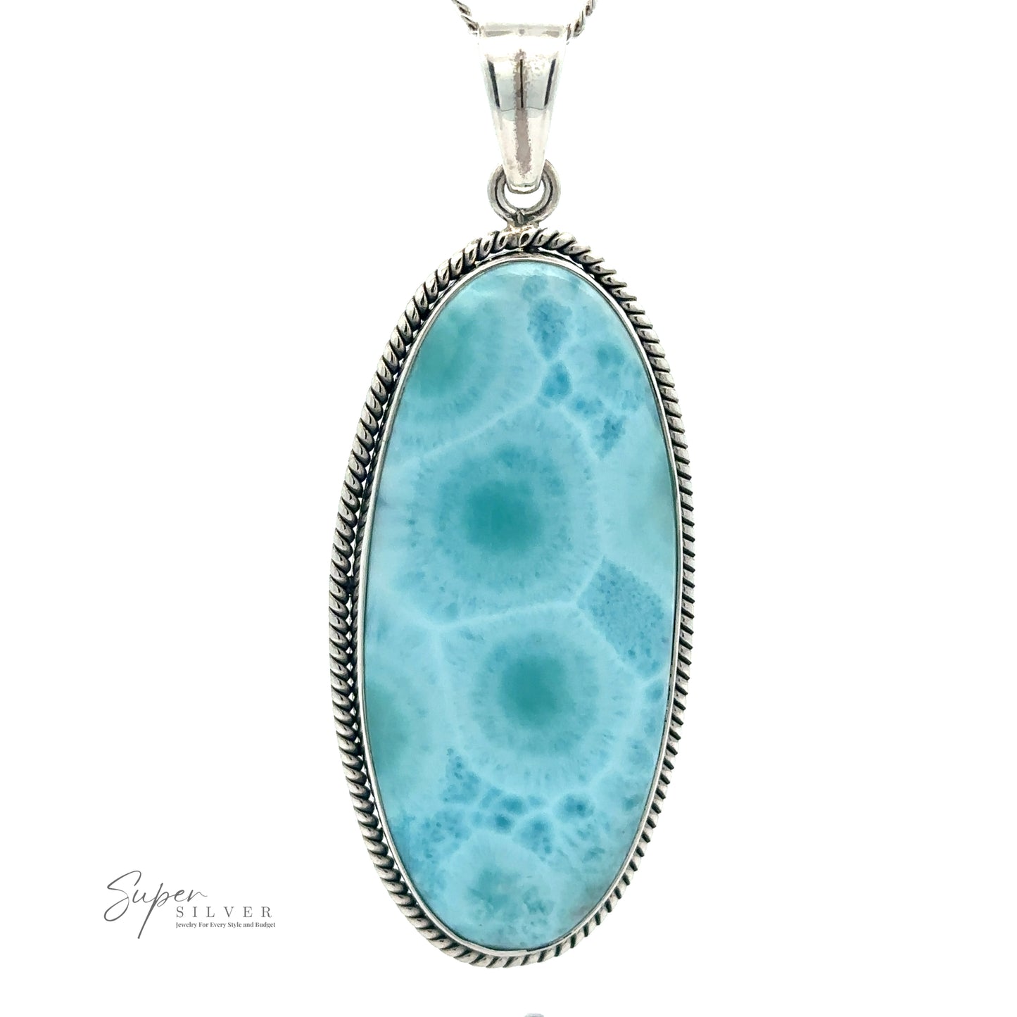 An Oblong Larimar Pendant with Rope Border featuring an oval larimar stone with intricate blue and white patterns, hanging from a chain. The statement jewelry piece has a detailed rope-like border and measures 27x71mm.