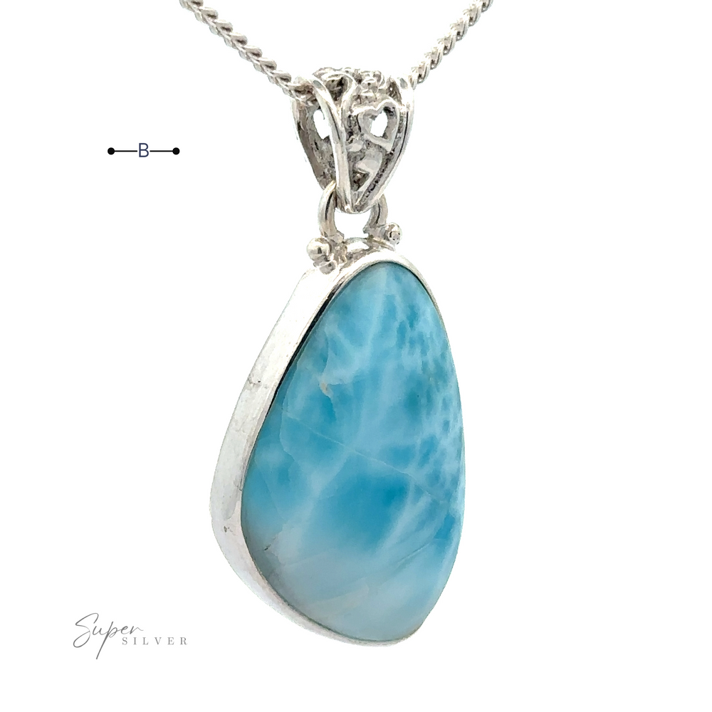 
                  
                    Close-up of a sterling silver pendant featuring a polished teardrop-shaped blue Larimar gemstone. The Freeform Shape Larimar Pendants are attached to a silver chain and have ornate detailing at the top. (Chain not included.)
                  
                