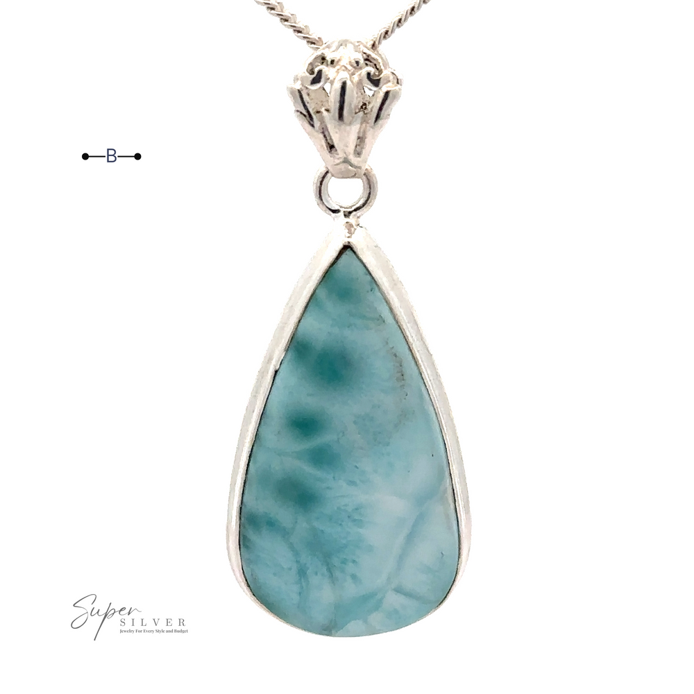 
                  
                    A Teardrop Larimar Pendant set in .925 Sterling Silver hangs from a silver chain, featuring the brand name "Super Silver" near the bottom. Note: chain not included.
                  
                