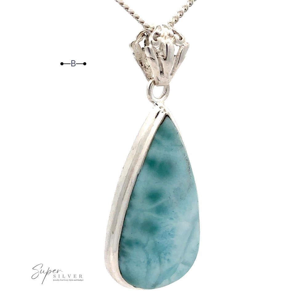
                  
                    A Teardrop Larimar Pendant set in .925 Sterling Silver, hanging from a silver chain. The pendant has a smooth, polished surface. The text "Super Silver" is visible in the lower left corner.
                  
                