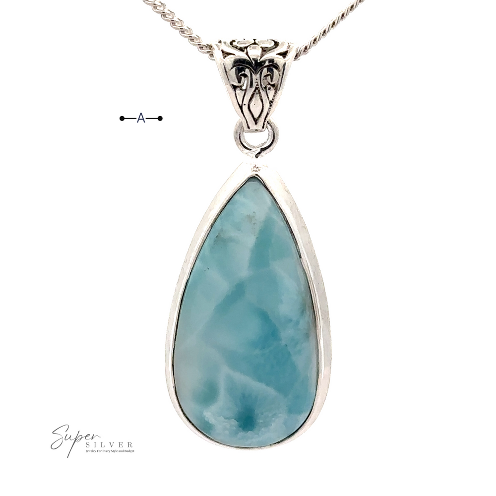 
                  
                    A Teardrop Larimar Pendant set in a .925 Sterling Silver frame. The pendant features intricate silver designs at the top, completing its elegant look. Chain not included.
                  
                