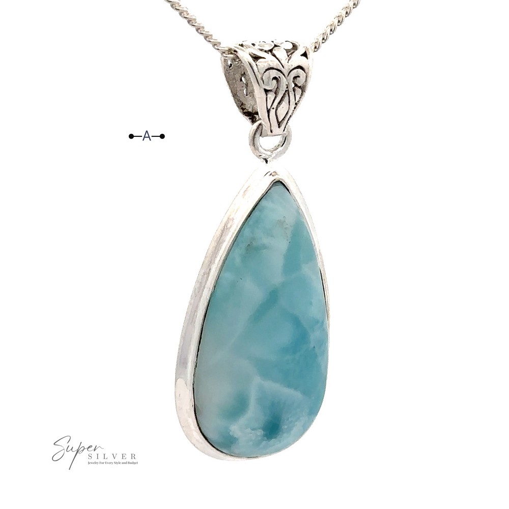 
                  
                    A Teardrop Larimar Pendant set in .925 Sterling Silver with a decorative bail, hanging from a twisted silver chain marked "Super Silver" (chain not included).
                  
                