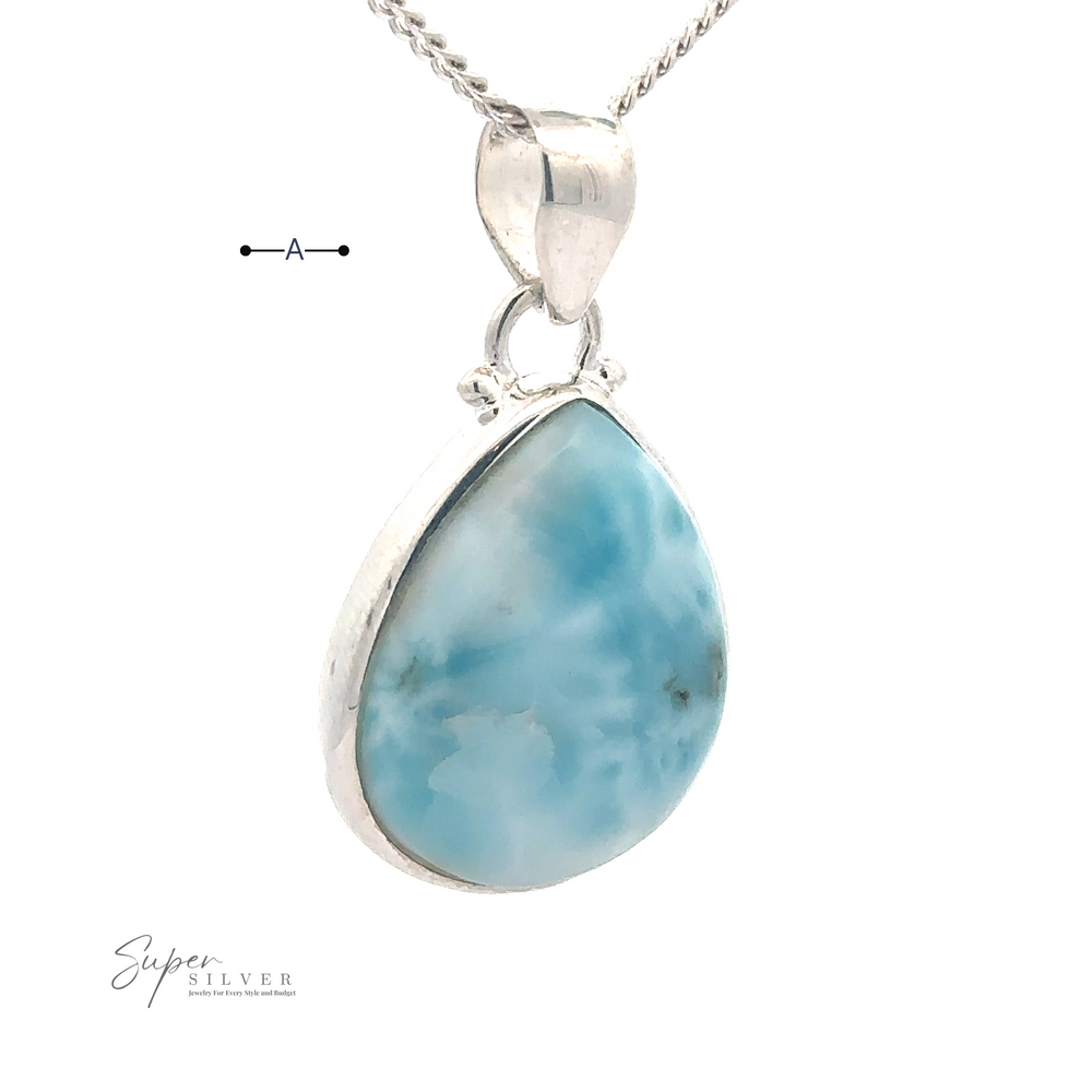 
                  
                    A Small Teardrop Larimar Pendant featuring a teardrop-shaped blue Larimar gemstone with a polished surface. The brand name "Super Silver" is visible at the bottom left corner, making it the perfect accessory for a night out.
                  
                