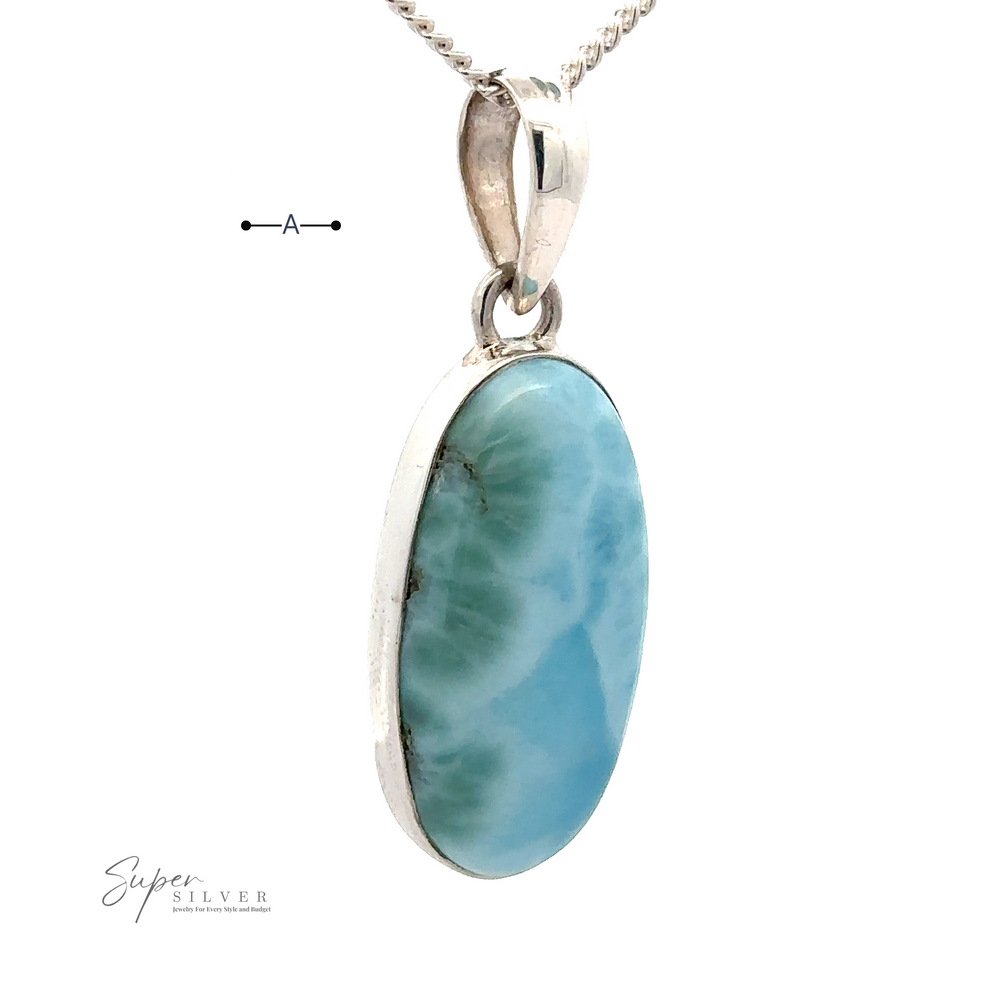 
                  
                    Close-up of a silver necklace with a Beautiful Long Oval Larimar Pendant, sourced from the Dominican Republic. The logo "Super Silver" is visible at the bottom left.
                  
                