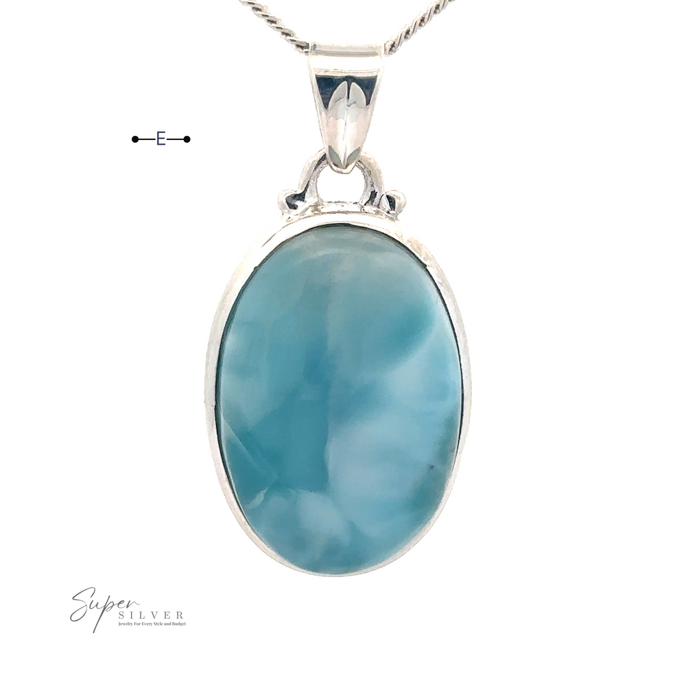 
                  
                    A Small Oval Larimar Pendants necklace featuring a large oval blue gemstone with varying shades of Larimar blue. The pendant is on a thin silver chain, perfect for everyday wear. The text "Super Silver" is visible at the bottom left.
                  
                