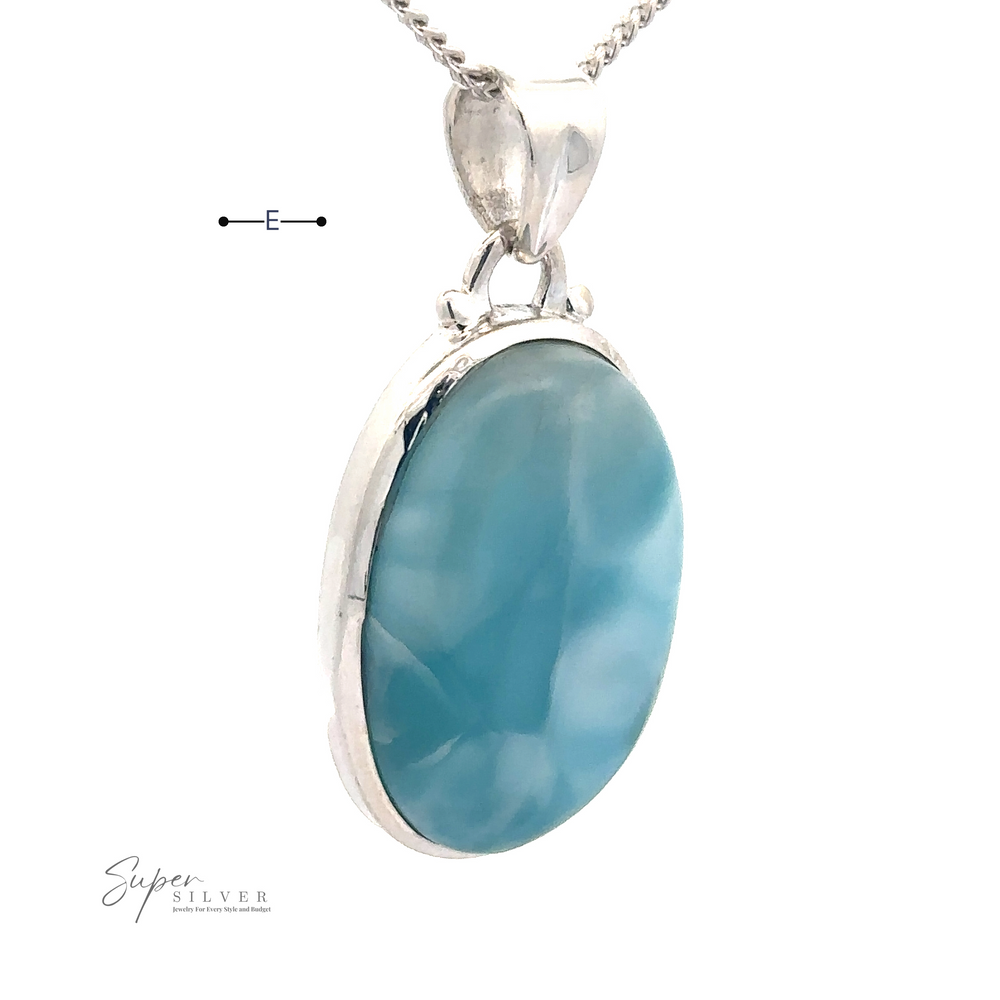 
                  
                    A close-up of a sterling silver necklace with a Small Oval Larimar Pendant. The pendant hangs from a polished, reflective chain, perfect for everyday wear. The brand "Super Silver" is marked on the image.
                  
                