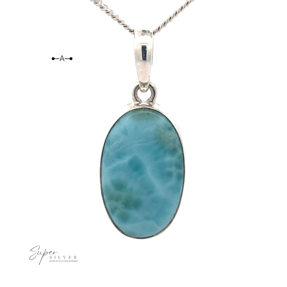 
                  
                    A Small Oval Larimar Pendant necklace with a sterling silver chain. The pendant features blue-green marbling and a silver setting, ideal for everyday wear. The image includes the text "Super Silver" at the bottom left.
                  
                