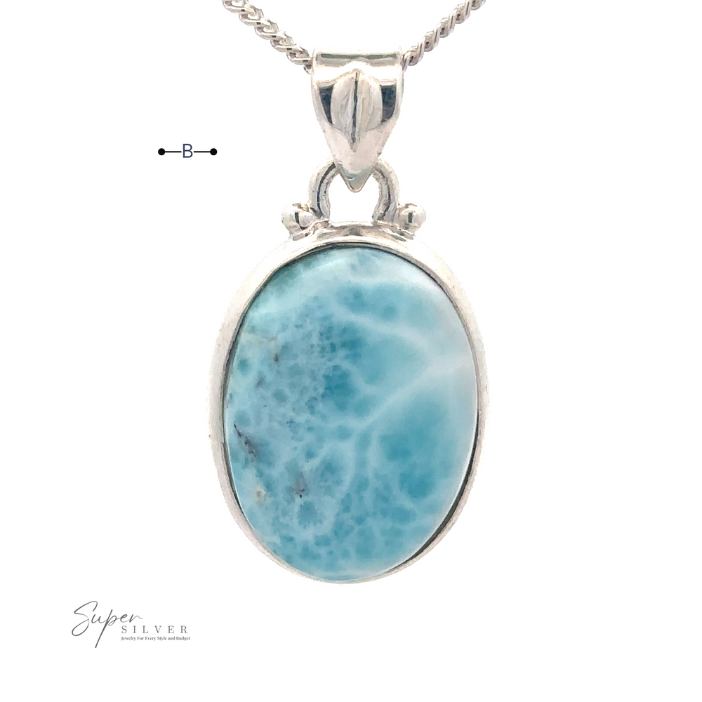 
                  
                    A blue oval Small Oval Larimar Pendant on a Sterling Silver chain, perfect for everyday wear, with "Super Silver" branding in the bottom left corner.
                  
                