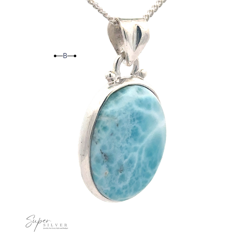 
                  
                    A silver necklace with a blue oval Larimar gemstone pendant on a white background, perfect for everyday wear, featuring the "Small Oval Larimar Pendants" logo in the bottom left corner.
                  
                