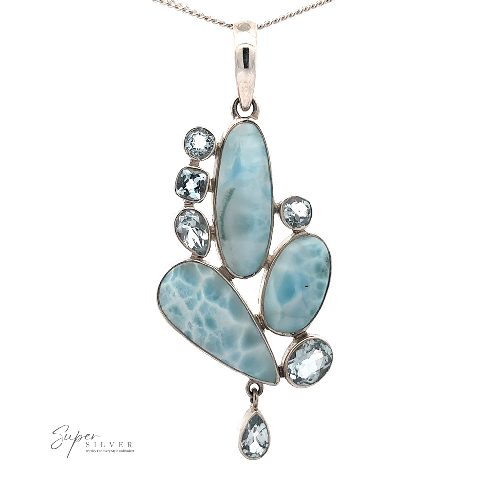 A Beautiful Larimar and Blue Topaz Pendant featuring a combination of three elongated blue larimar stones and four blue topaz gemstones, set in an asymmetrical design. Crafted with .925 sterling silver, the Super Silver logo is visible in the bottom left corner.
