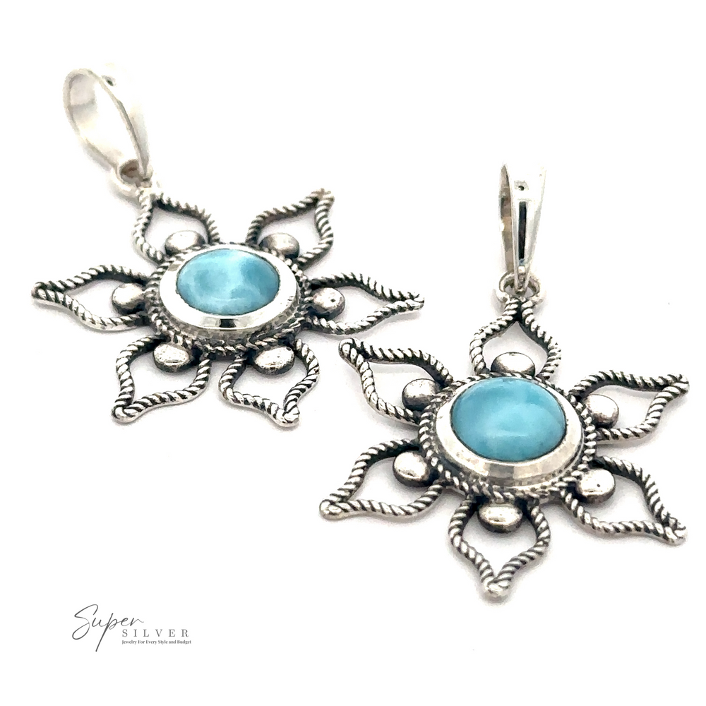 A Larimar Flower Pendant with a Larimar stone in the center, designed in a sunburst pattern, perfect for a beach day.