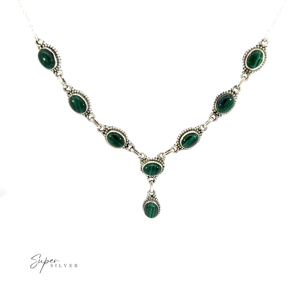 
                  
                    A Gemstone Y-Necklace with Beaded Border, featuring green stones and a silver chain, including a single gemstone drop pendant available in various options.
                  
                