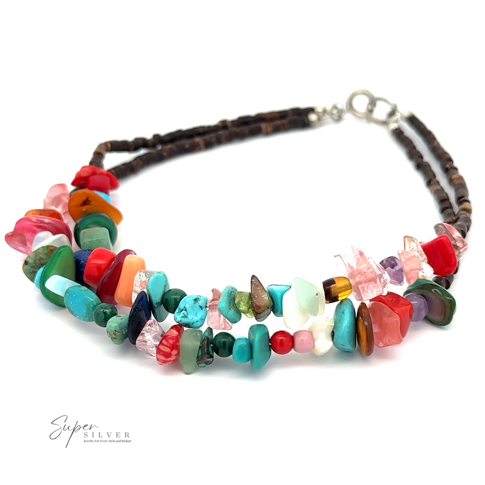 
                  
                    A Colorful Southwest Beaded Stone Anklet with bohemian charm, featuring a two-strand design and a silver clasp, displayed against a plain white background.
                  
                