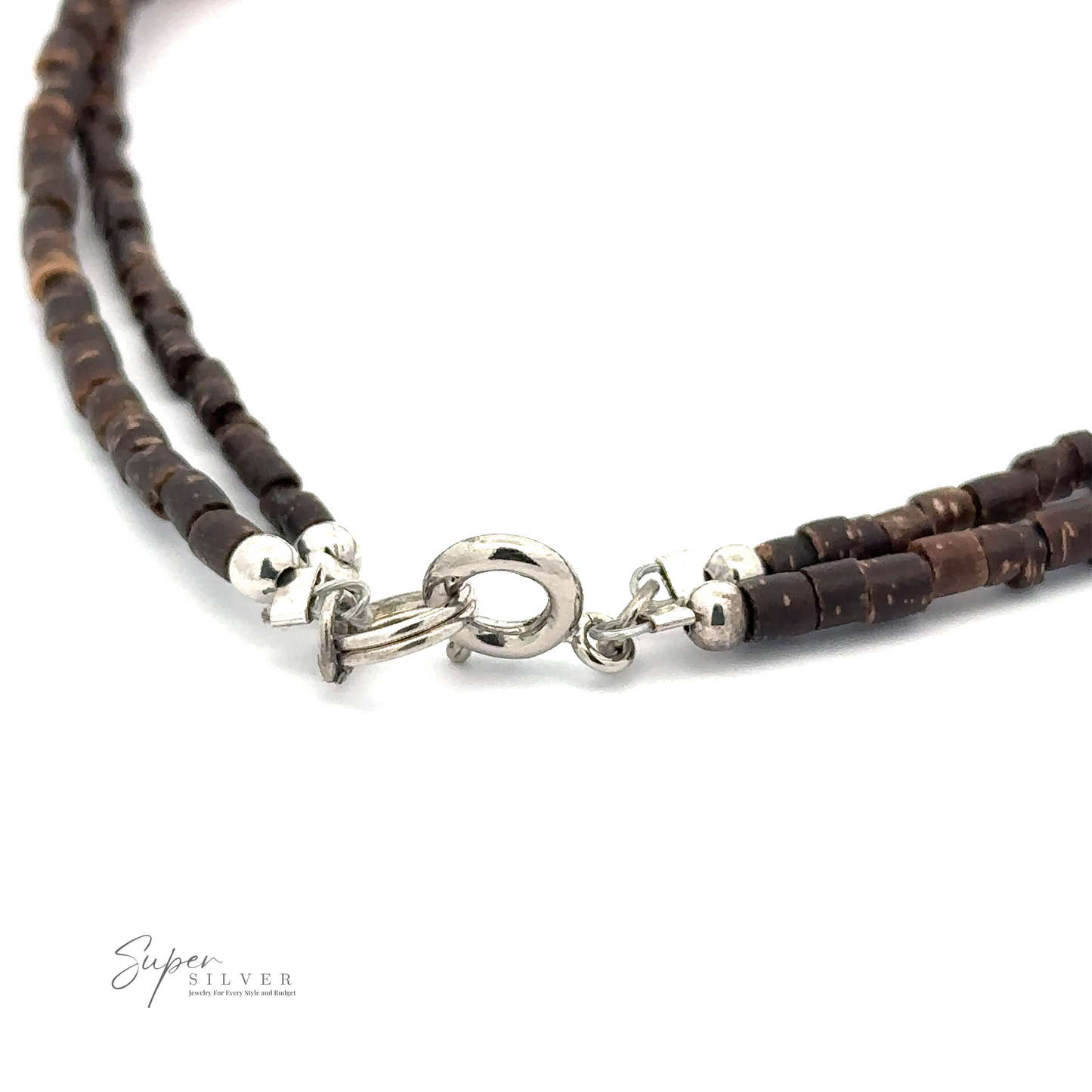 
                  
                    Close-up of a double-strand necklace made of dark brown beads with silver accents, featuring a silver clasp. The logo "Colorful Southwest Beaded Stone Anklet" is visible in the bottom left corner, reminiscent of the elegance found in their double beaded anklet collection.
                  
                