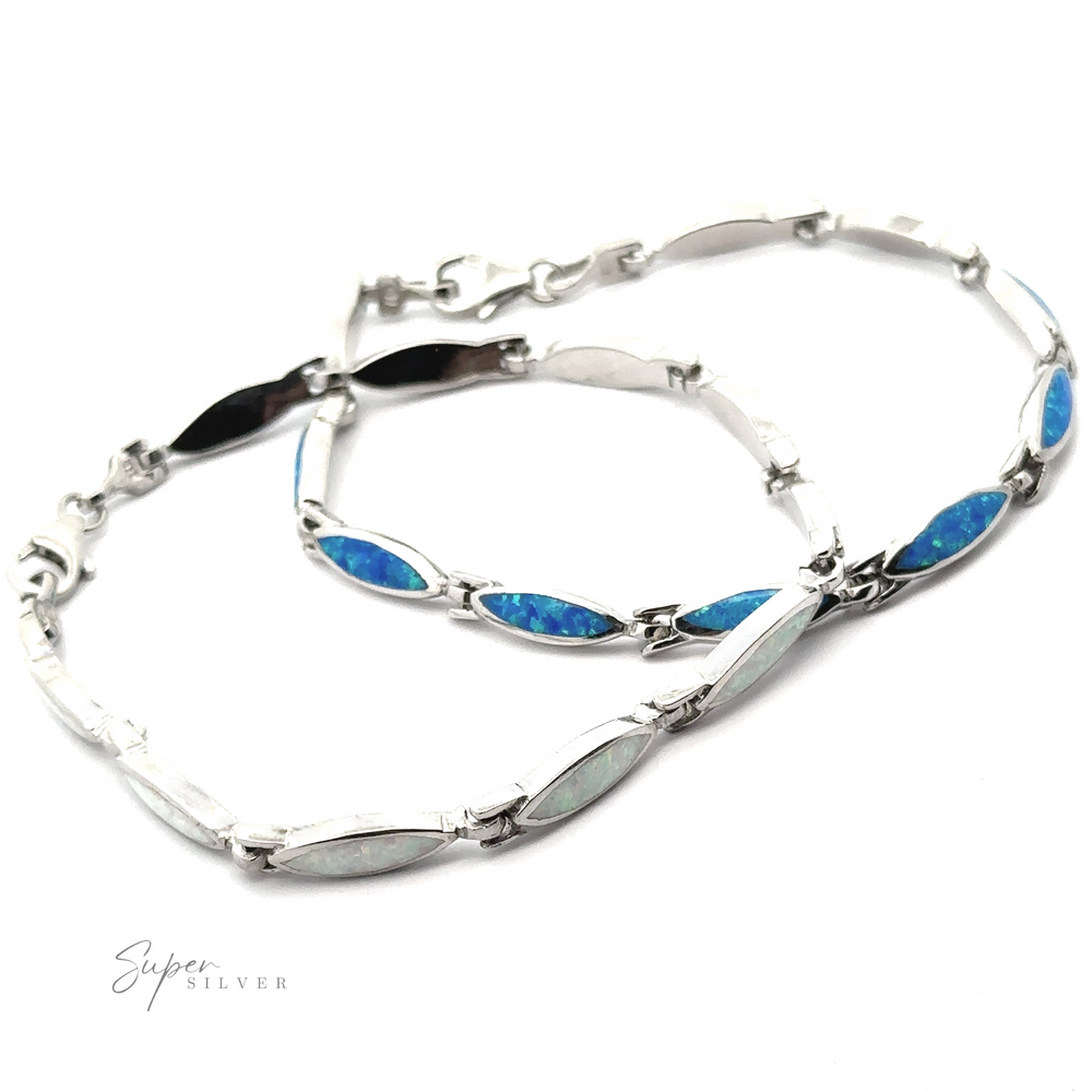 Two Marquise Shaped Lab-Created Opal Bracelets, crafted from .925 Sterling Silver, featuring alternating blue and white opal inlays. Their modern design is enhanced by the brilliance of lab-created opals. Displayed on a white background with "Super Silver" branding.