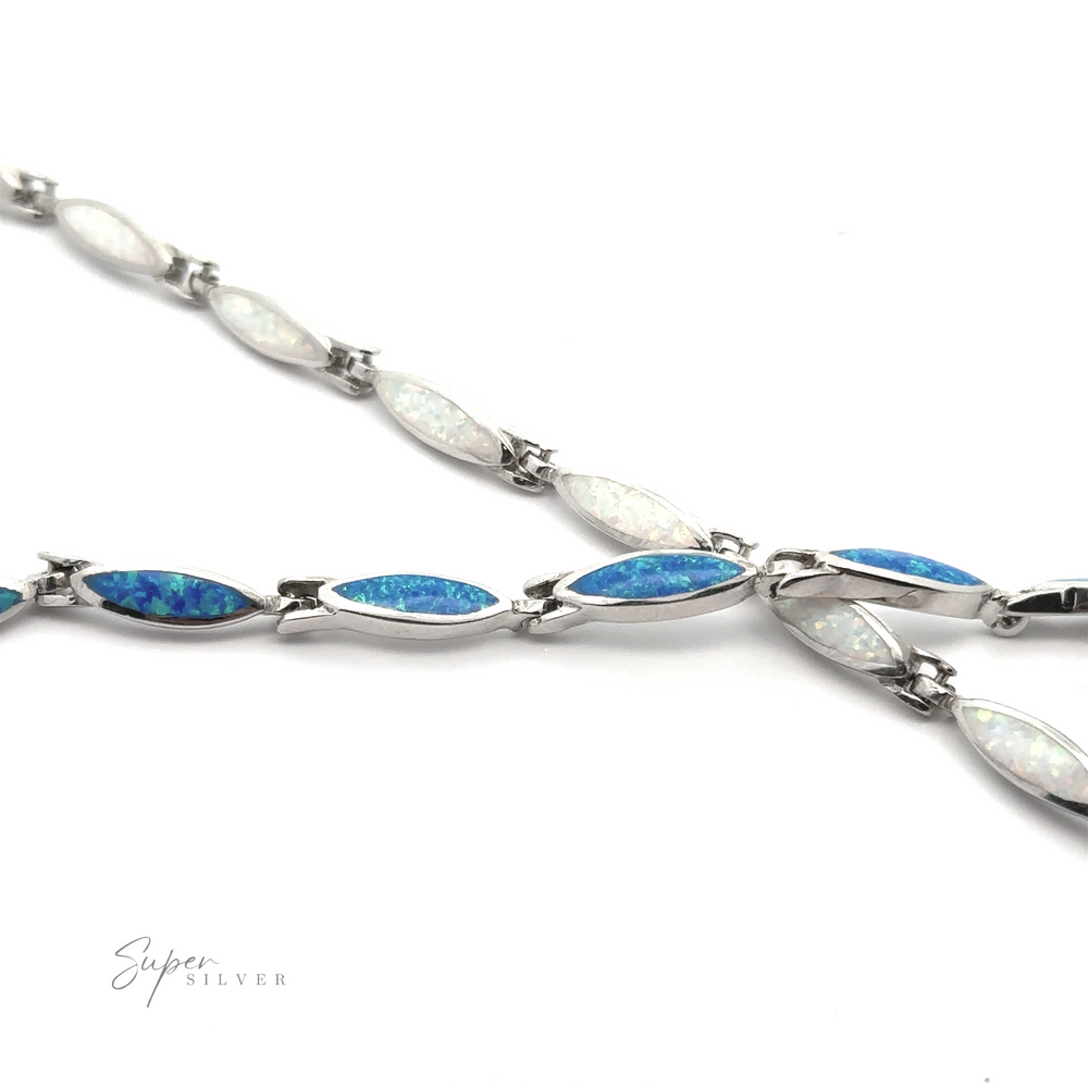 
                  
                    A Marquise-Shaped Lab-Created Opal Bracelet featuring alternating blue and white opal stones in a linked pattern, crafted in .925 Sterling Silver. The background is white with the text "Super Silver" in the bottom left corner.
                  
                