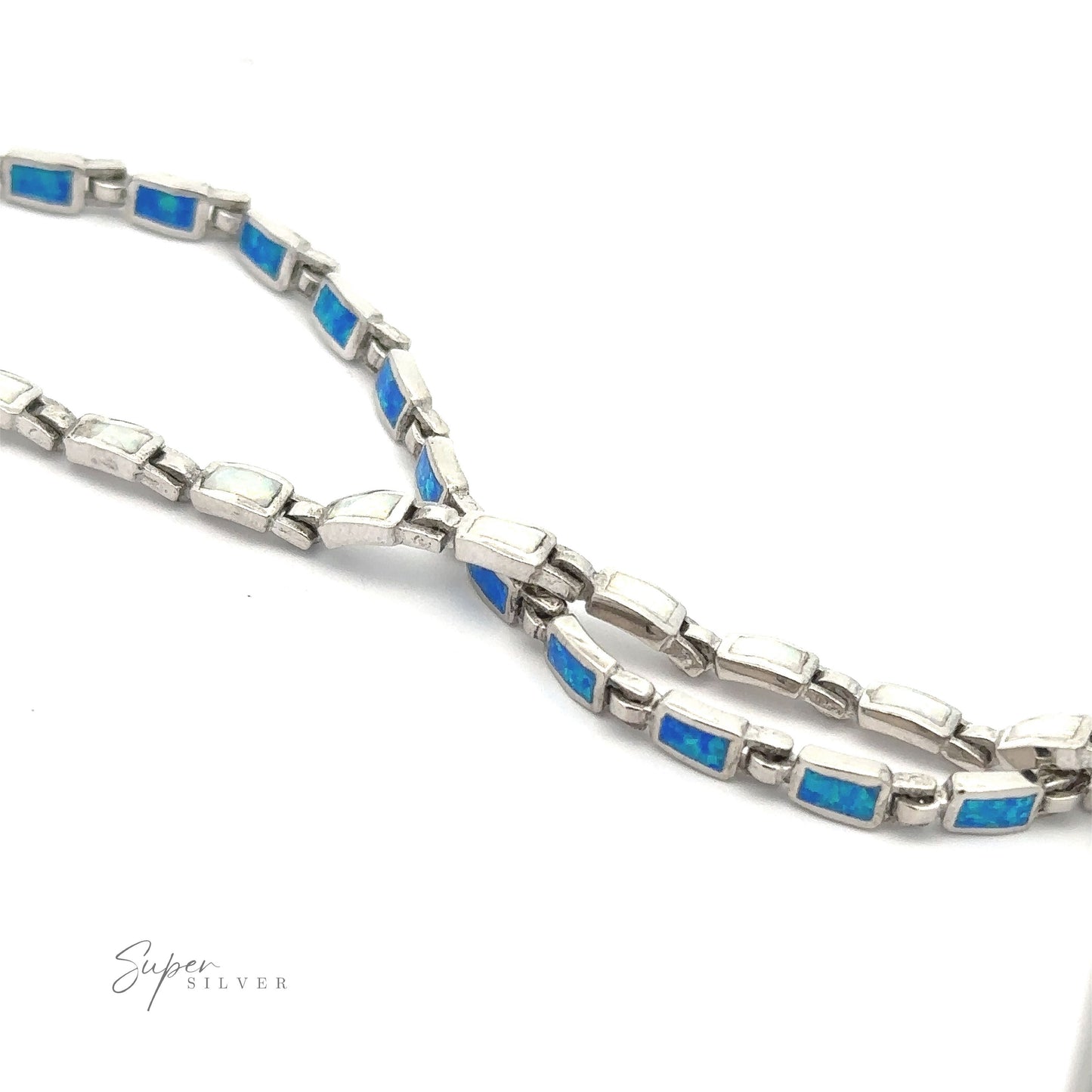 Close-up of the Rectangle Lab-Created Opal Bracelet, arranged in a loose loop. The bracelet features rectangular segments with blue opal inlays and a polished sterling silver finish. The "Super Silver" logo is visible in the lower left corner, highlighting its modern elegance jewelry design.