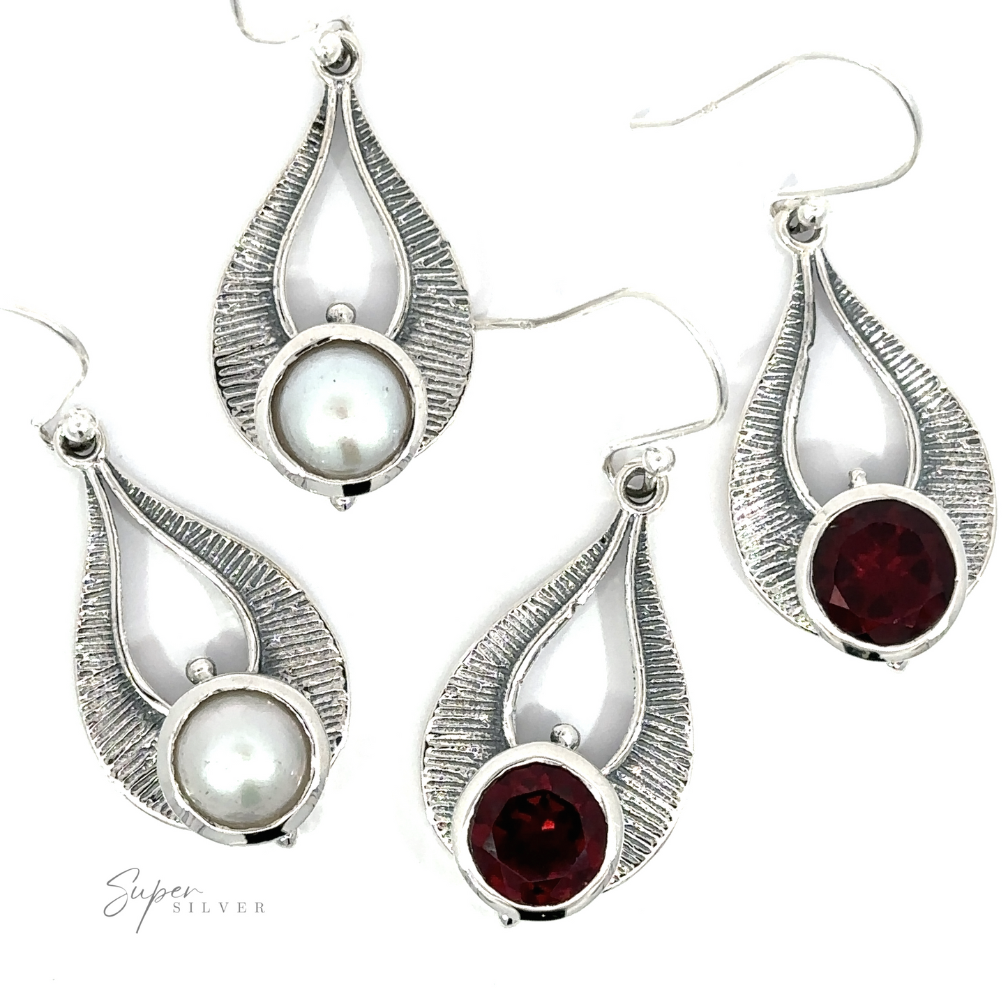 Four exquisite Winged Gemstone Earrings, comprising two adorned with pearl-like stones and two embellished with garnet gemstones, all set in silver-tone metal with an elegant teardrop design.