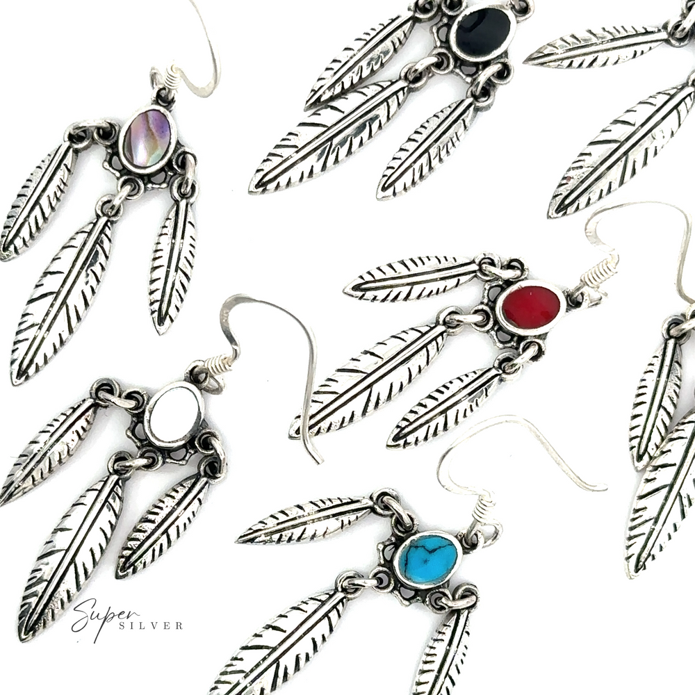Assorted Western Inspired Earrings With Feather Dangles and Inlay Stones.