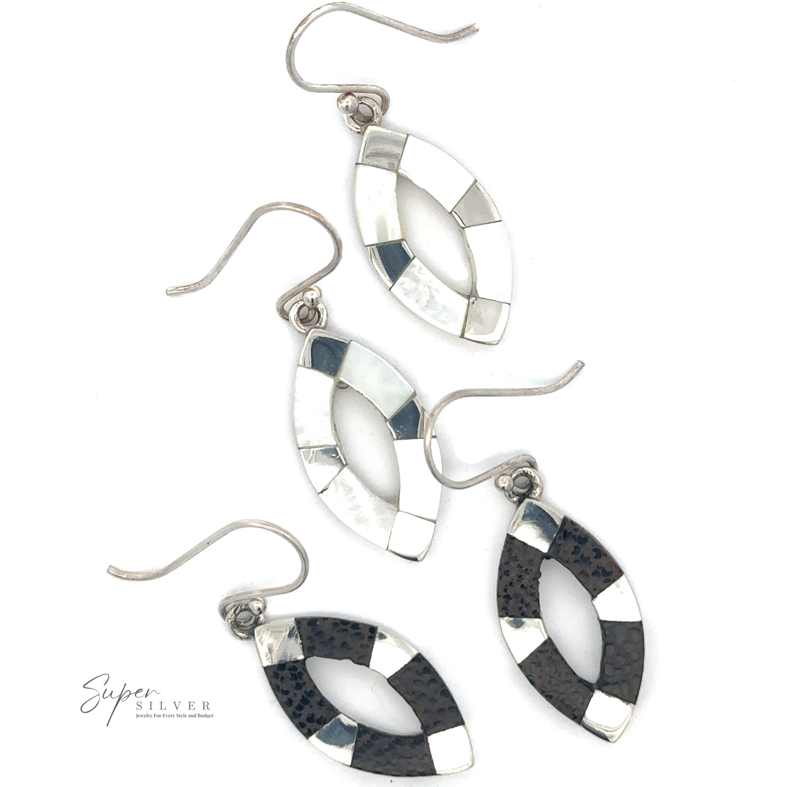 Two pairs of Inlaid Marquise Dangle Earrings, one with a white and silver mosaic pattern and the other with a black and silver mosaic pattern, laid on a white surface.