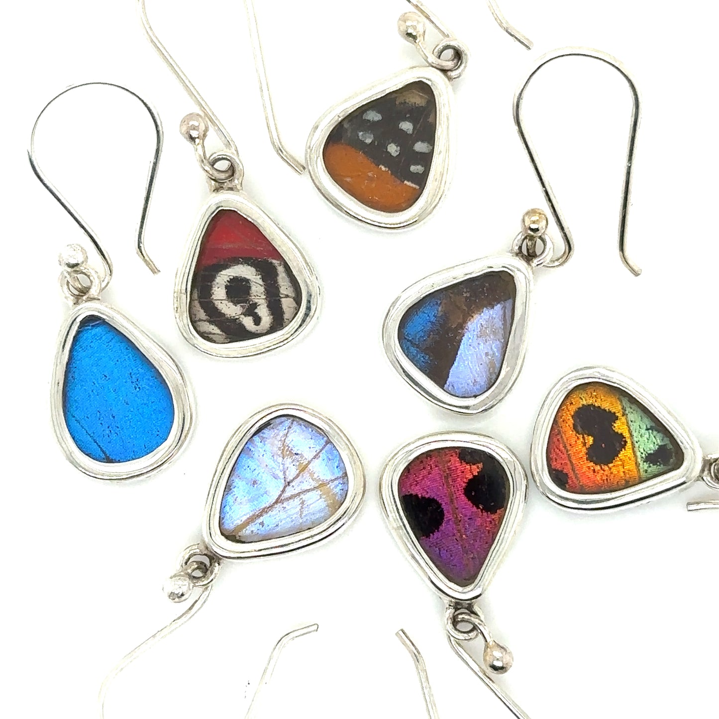 A group of colorful Small Wide Teardrop Butterfly Wing Earrings on a white background.