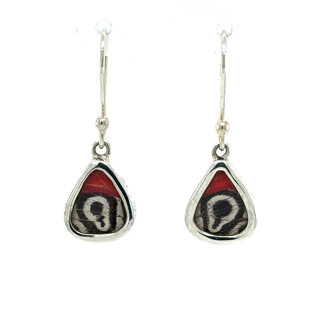 A pair of Small Wide Teardrop Butterfly Wing Earrings with a red and black butterfly design.